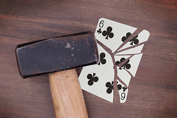 Image showing Hammer with a broken card, six of clubs