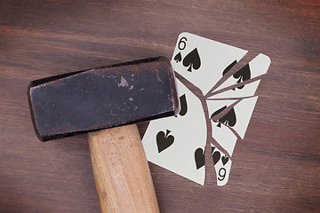 Image showing Hammer with a broken card, six of spades