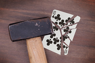 Image showing Hammer with a broken card, ten of clubs