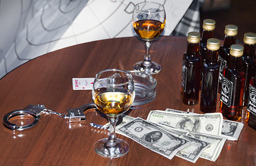 Image showing money and whiskey