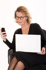 Image showing senior secretary with laptop in the SMS delivery