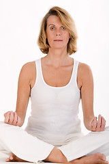 Image showing older woman doing yoga in the stand