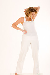 Image showing older woman doing yoga in the stand