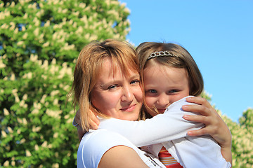 Image showing mother and daughter embrace