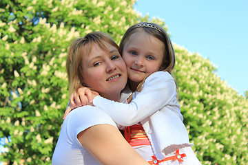 Image showing mother and daughter embrace