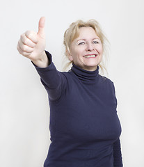 Image showing Woman showing thumbs