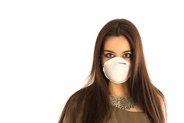 Image showing Attractive woman wearing a protective mask