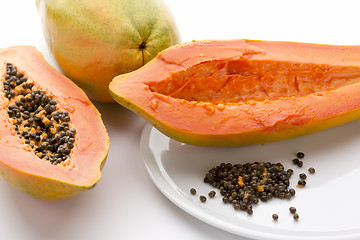 Image showing Hollowed Out Papaya Half And Its Peppery Seeds