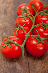 Image showing fresh cherry tomatoes on a cluster