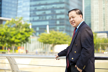 Image showing Asian businessman smiling portrait