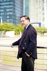 Image showing Asian businessman smiling portrait