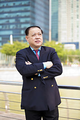 Image showing Asian businessman smiling portrait