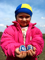 Image showing Two easter eggs in the child's hands