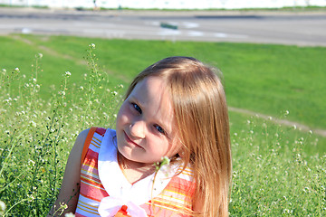 Image showing portrait of little girl lying on the grass