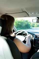 Image showing Young woman driving the car