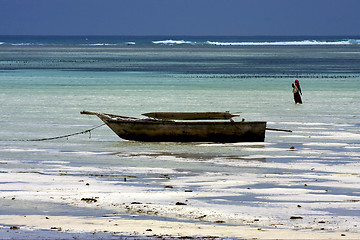 Image showing beach seaweed masai and boat in tanzania zanzibar