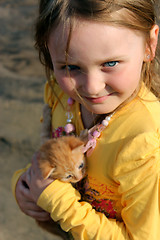 Image showing girl with little red kitten
