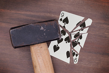 Image showing Hammer with a broken card, nine of spades