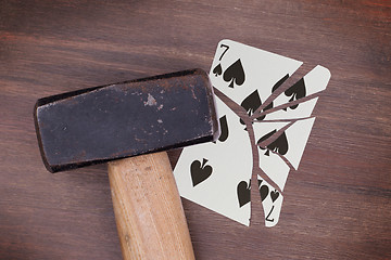 Image showing Hammer with a broken card, seven of spades