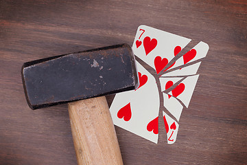 Image showing Hammer with a broken card, seven of hearts