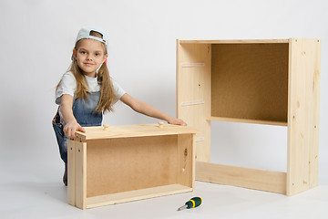 Image showing child plays in the builder furniture