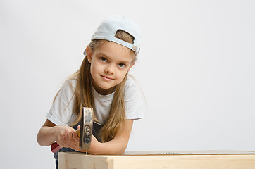 Image showing Child labor in classroom hammer nails with a hammer