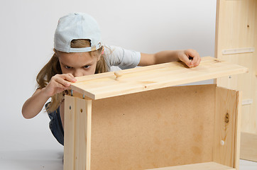 Image showing Girl collects facade box