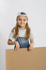 Image showing Girl holding a wooden board