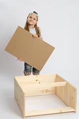 Image showing Child carpenter collects dresser