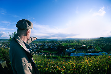 Image showing elderly man in nature at sunset