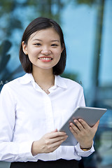 Image showing Asian young female executive using tablet