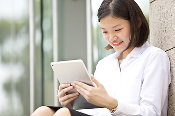 Image showing Asian young female executive using tablet