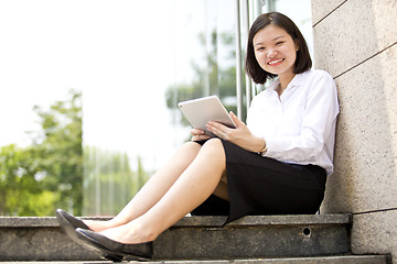 Image showing Asian young female executive using laptop