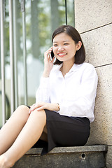 Image showing Asian young female executive talking on smart phone