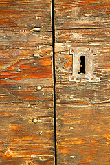 Image showing abstract  house  door     in red   the milano old        closed 