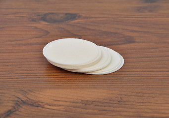 Image showing Paper wafers on wood
