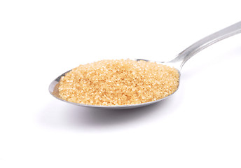 Image showing Brown cane sugar on spoon