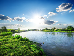 Image showing Sun over river