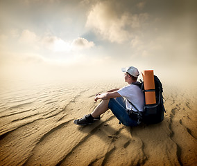 Image showing Tourist in sand desert