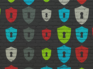 Image showing Safety concept: multicolor Shield With Keyhole icons on wall background