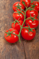 Image showing fresh cherry tomatoes on a cluster