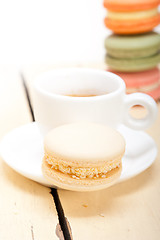 Image showing colorful macaroons with espresso coffee 