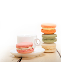 Image showing colorful macaroons with espresso coffee 