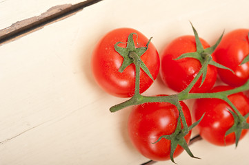 Image showing fresh cherry tomatoes on a cluster