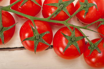 Image showing fresh cherry tomatoes on a cluster