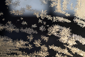 Image showing Snowflakes frozen glass 