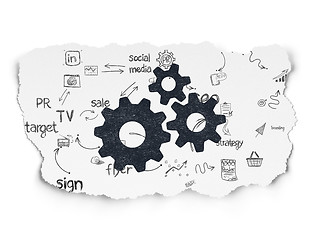Image showing Advertising concept: Gears on Torn Paper background