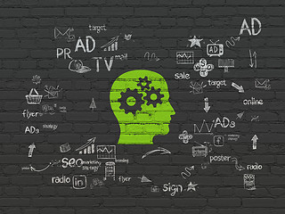 Image showing Advertising concept: Head With Gears on wall background