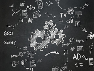 Image showing Advertising concept: Gears on School Board background