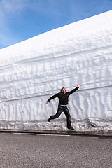 Image showing highway along the snow wall. Norway in spring